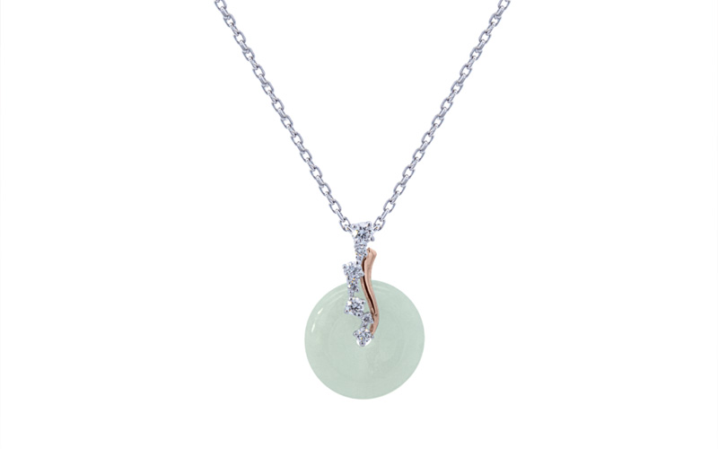 Silver necklace with jade gemstone pendant.